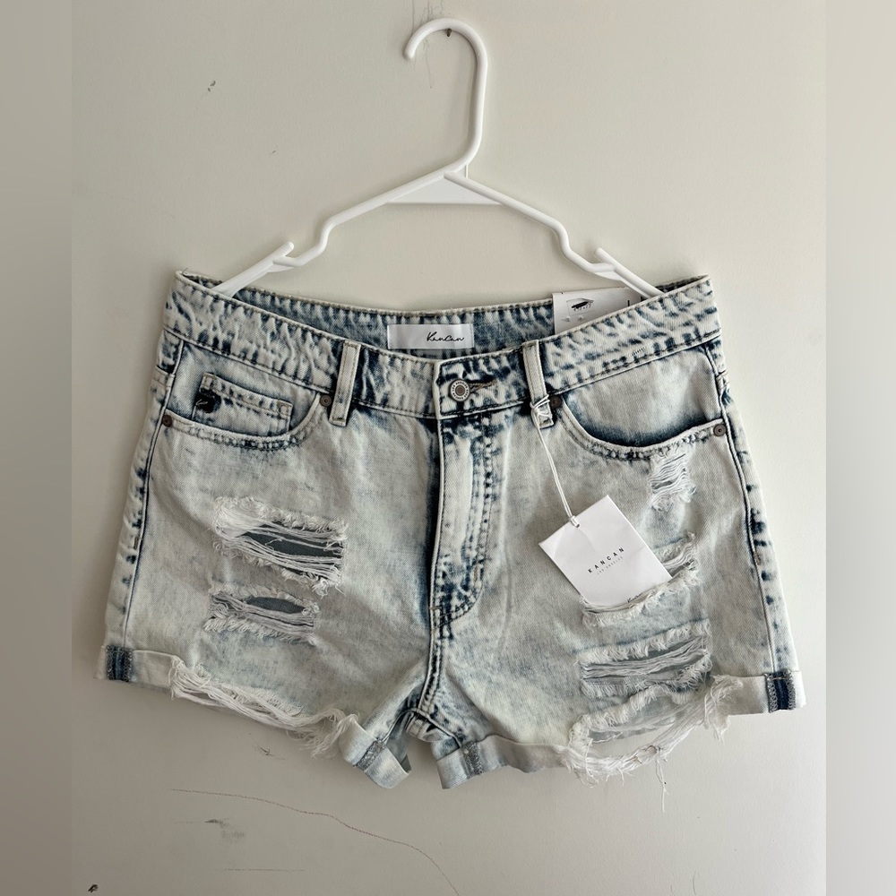 A pair of blue denim high waisted shorts from Kancan.